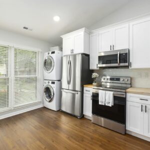 A White Kitchen Cabinets Near the Appliances