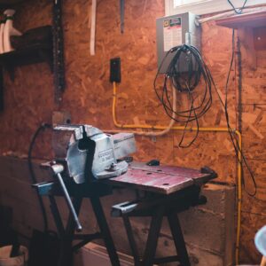 Steel machine in modern messy workshop