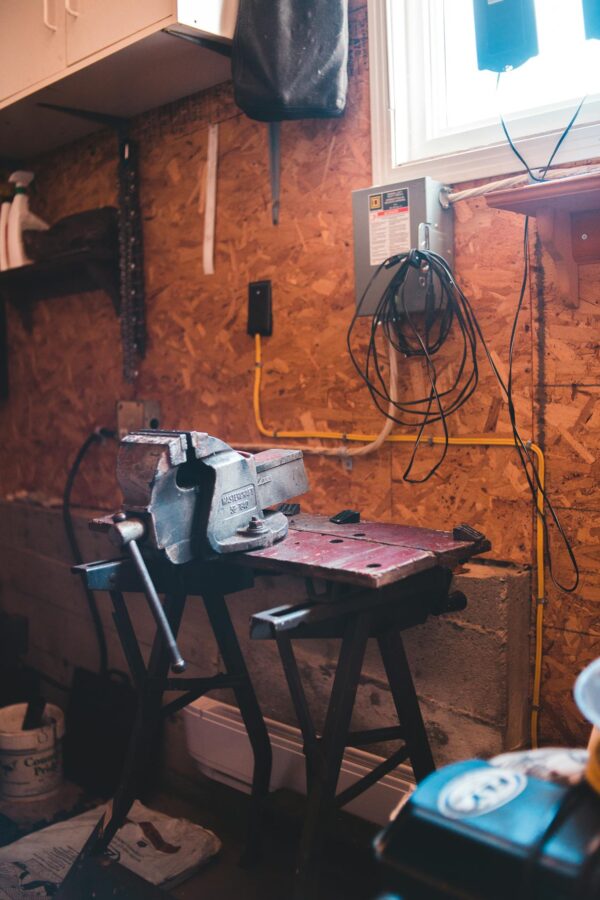 Steel machine in modern messy workshop